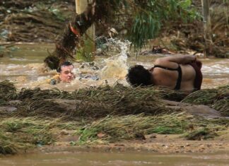 Hero cop almost swept away in brave rescue attempt