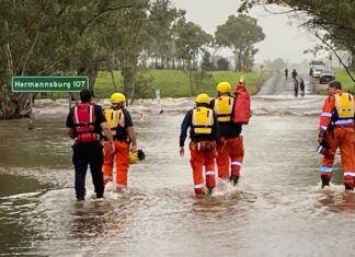 Rescuers pull two from flooded creek